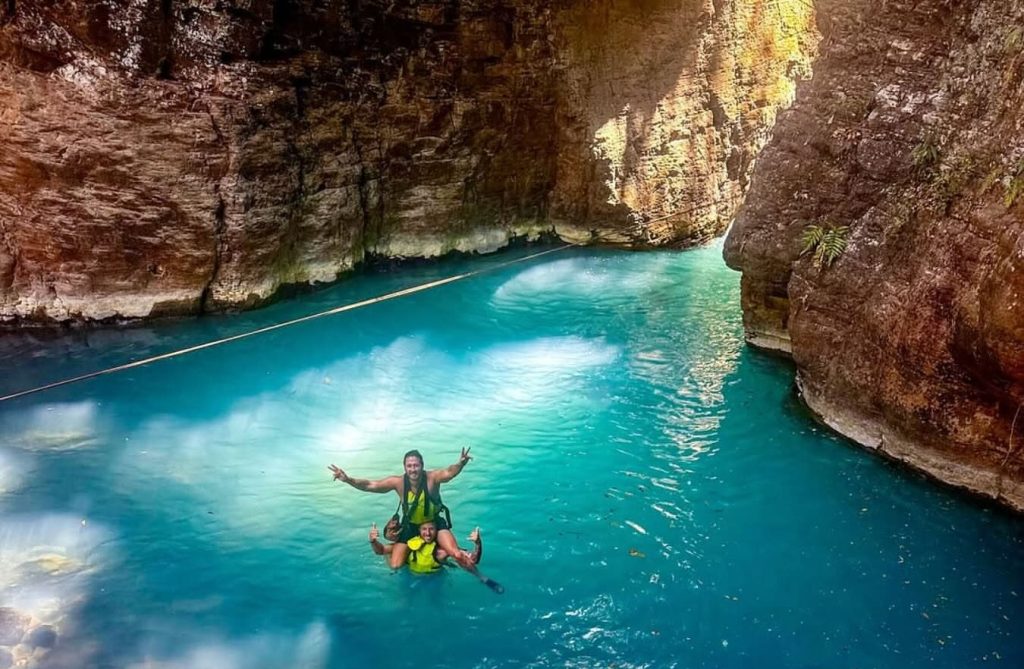Swimming through the turquoise canyon at La Leona Waterfall